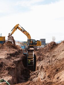 Digger in trench