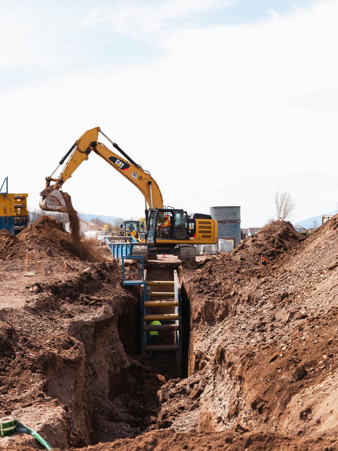 Digger in trench