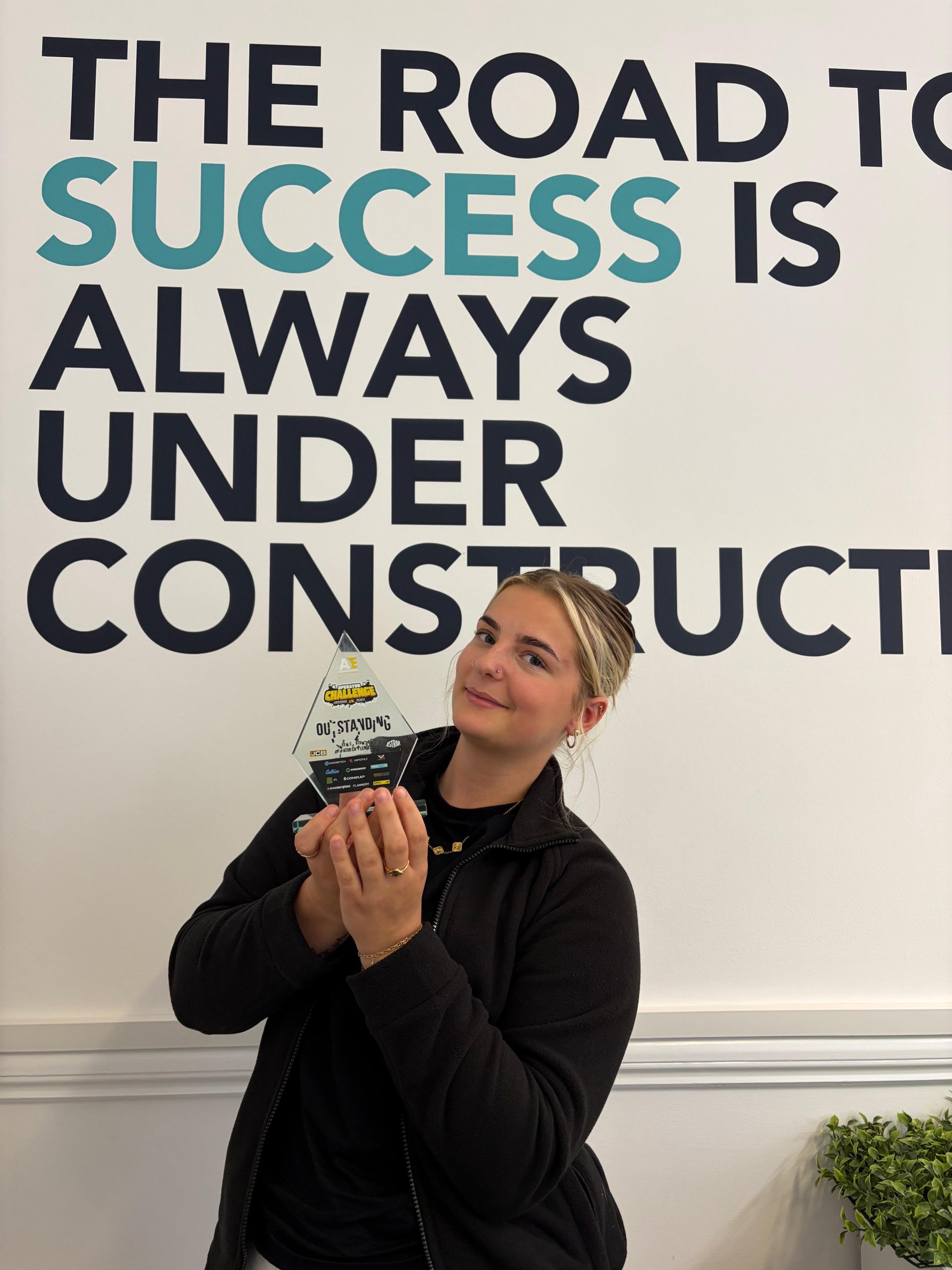 Caitlin with her award